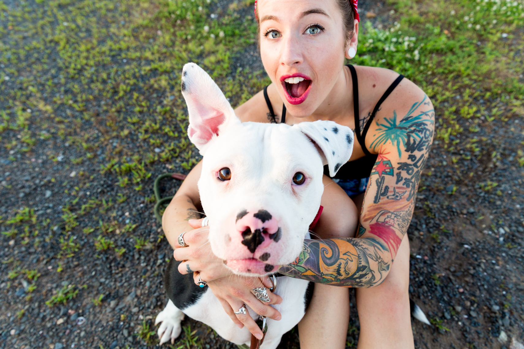 Tattooed girl with a sleeve and her pit mix